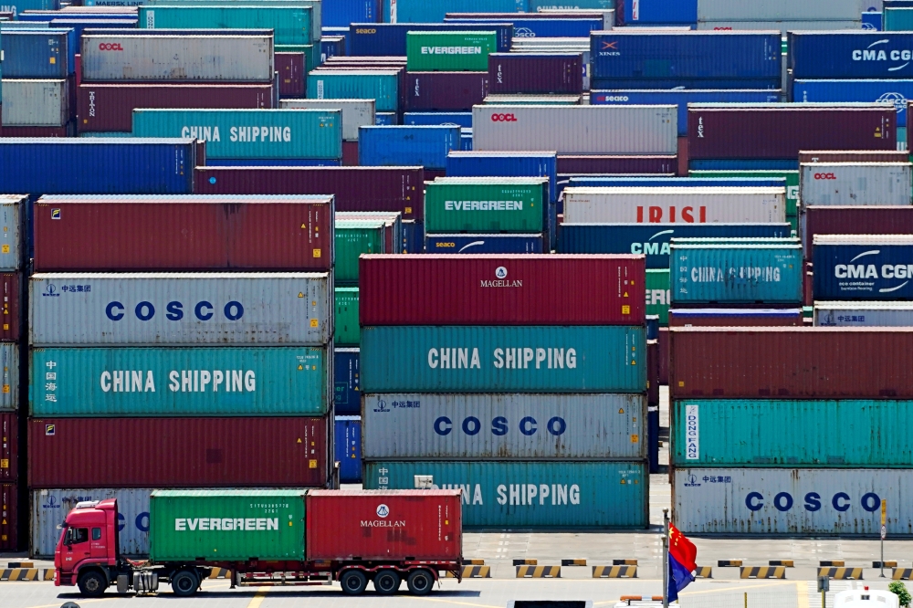Containers are seen at the Yangshan Deep Water Port in Shanghai