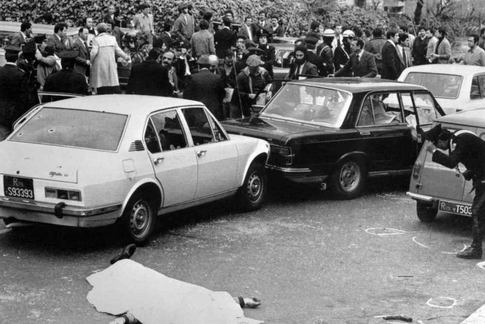 This file photograph taken on March 16, 1978, shows crowds gathering near the site where five-time Italian Prime Minister Aldo Moro was kidnapped, near his home in Rome. - AFP  