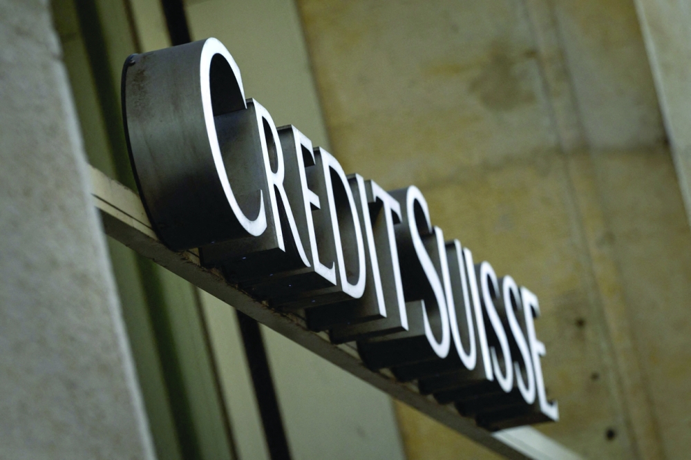 A sign of Swiss banking Credit Suisse on a branch in Lausanne. - AFP