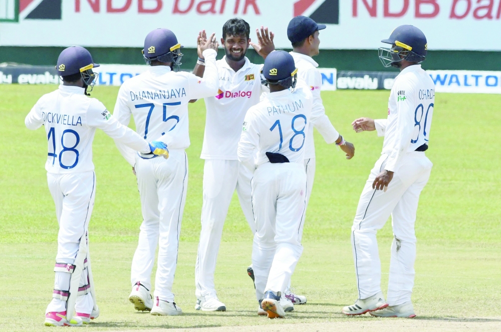 Sri Lanka's Ramesh Mendis (C) celebrates with teammates after he dismissed Bangladesh's Taskin Ahmed during the final day of the secondsecond and final Test cricket match between Sri Lanka and Bangladesh at the Pallekele International Cricket Stadium in Kandy on May 3, 2021.  / AFP / LAKRUWAN WANNIARACHCHI

