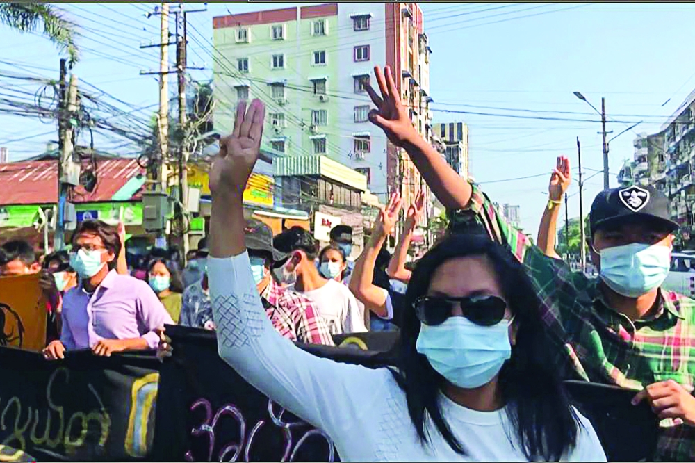 Protesters take part in a flash mob as part of demonstrations against the military coup on 'Global Myanmar Spring Revolution Day' in Yangon. - AFP 