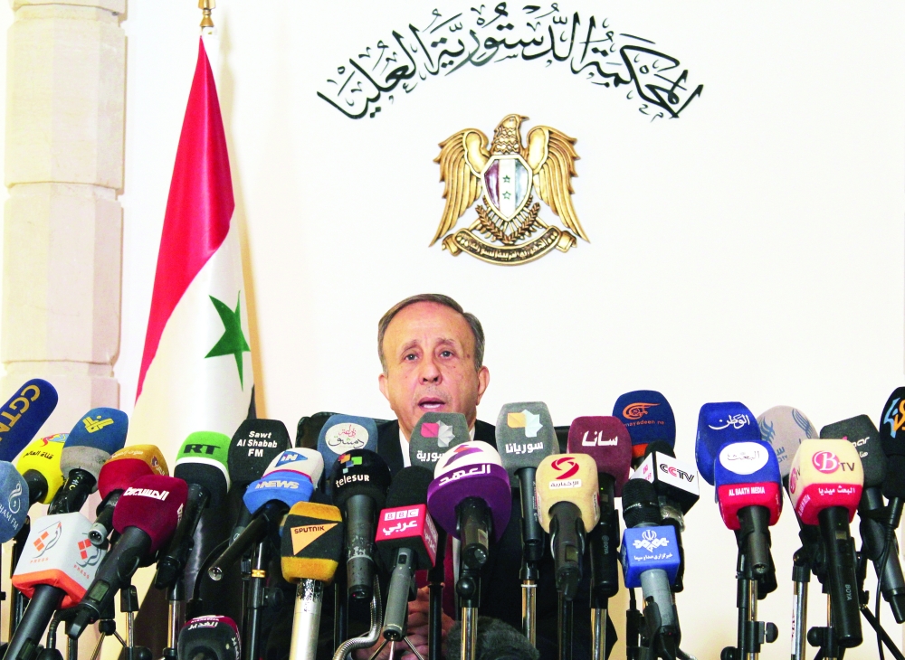 Head of the higher constitutional court, Jihad Al Laham during a news conference in Damascus. - Reuters