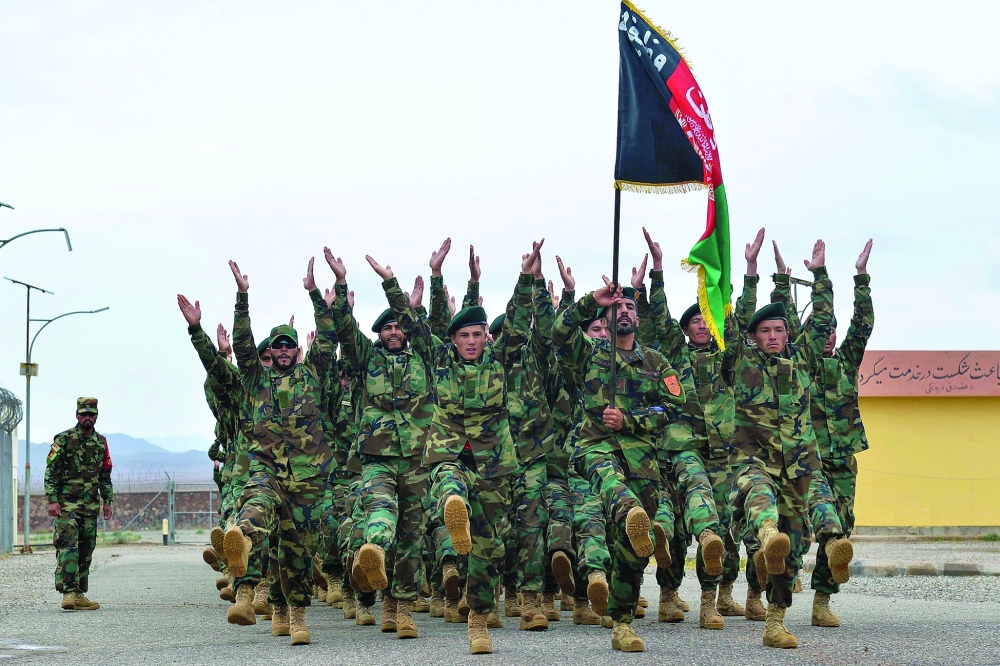 Afghan National Army (ANA) soldiers march during a ceremony at a military base in the Guzara district of Herat on Wednesday. - AFP