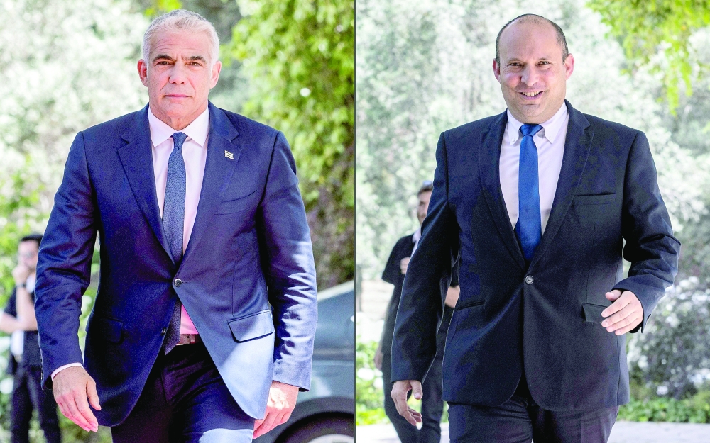 Yesh Atid party leader Yair Lapid and Yamina party leader Naftali Bennett. - AFP