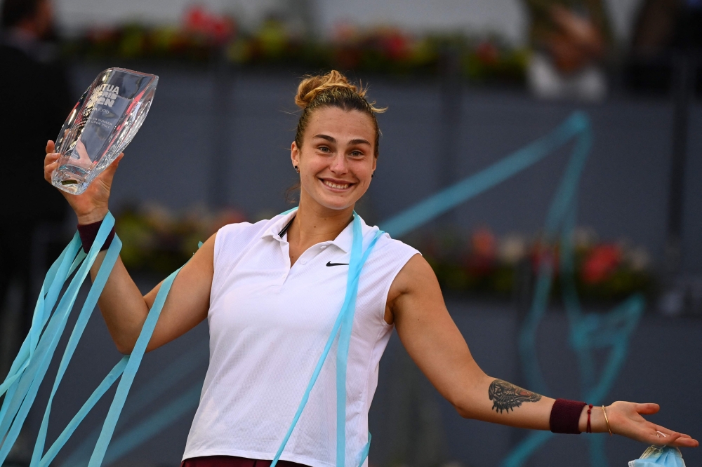 Belarus' Aryna Sabalenka poses with her trophy after beating Australia's Ashleigh Barty in Madrid. -- AFP