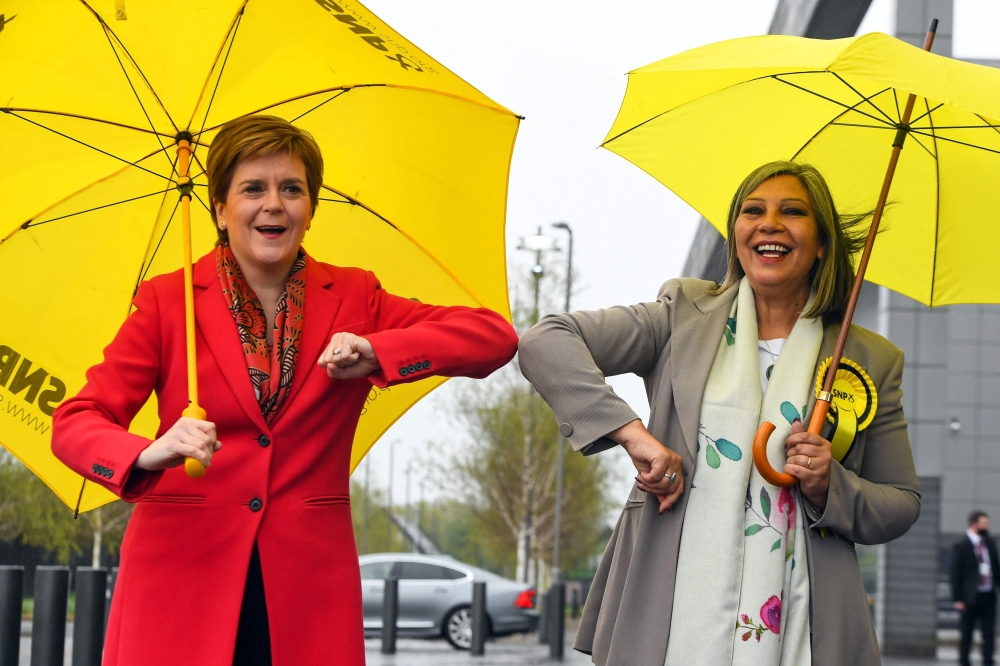 Scotland's First Minister and leader of the Scottish National Party (SNP), Nicola Sturgeon congratulates SNP candidate Kaukab Stewart after she was elected MSP for Glasgow Kelvin in the Scottish Parliamentary Election in Glasgow. - AFP 


