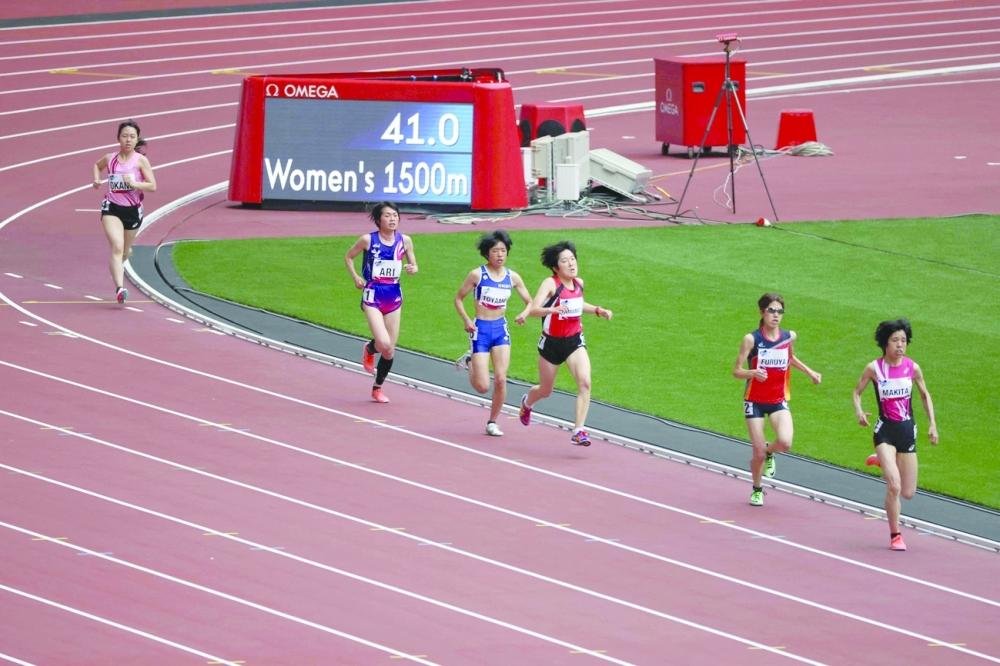 Athletes compete in a heat of the women's 1500m T20 category during a para-athletics test event for the 2020 Tokyo Olympics at the National Stadium in Tokyo. -- AFP