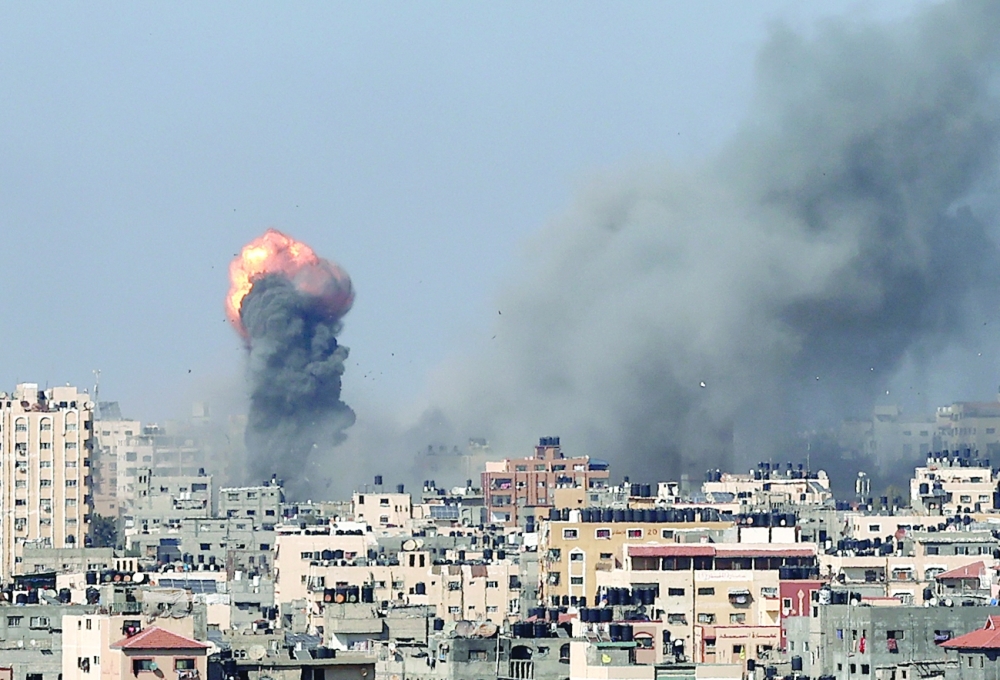 Smoke billows following Israeli airstrikes on Gaza City on Wednesday. - AFP