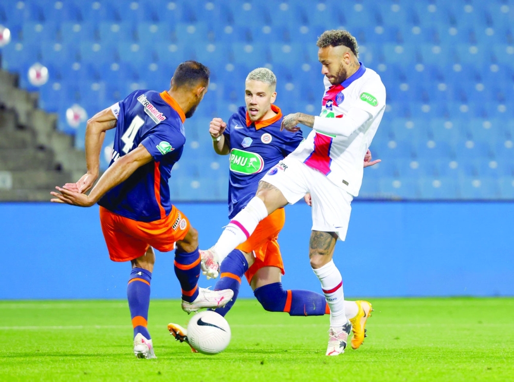 Paris St Germain's Neymar in action with Montpellier's Hilton. -- Reuters 