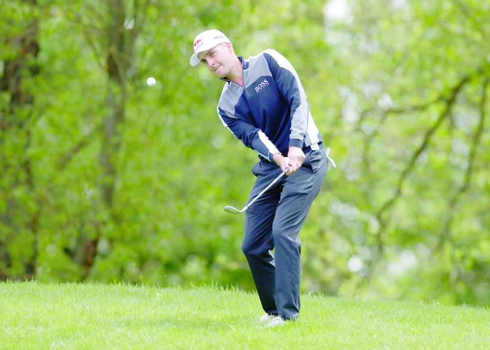 Austria's Matthias Schwab in action during the first round of British Masters. -- Reuters
