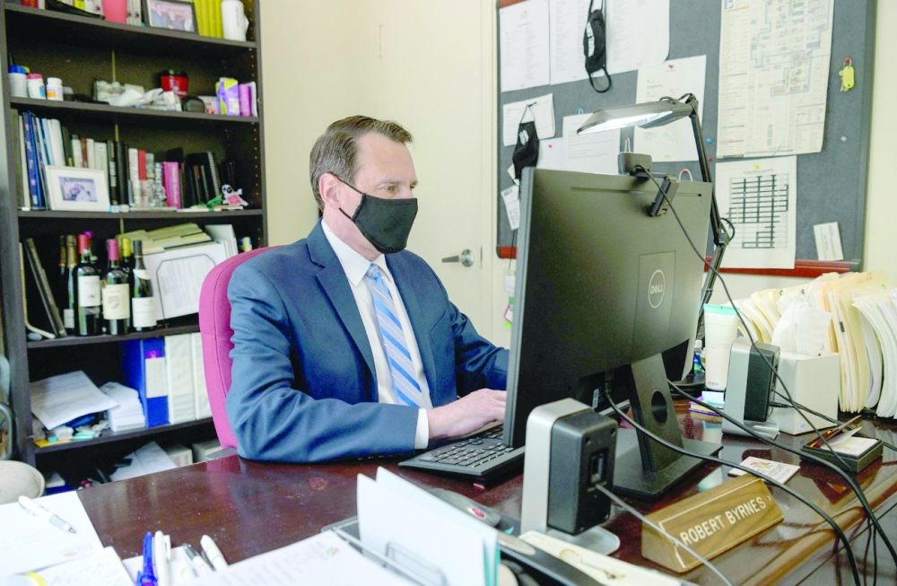 Rob Byrnes, President at East Midtown Partnership works in his office in midtown Manhattan in New York City. - AFP
