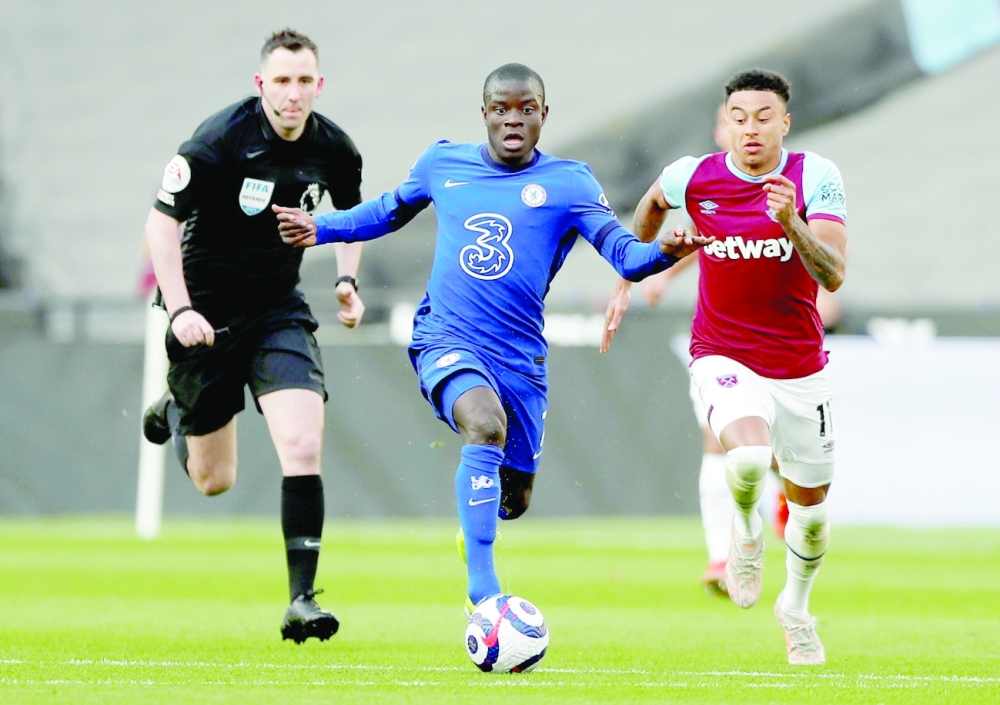 Chelsea's N'Golo Kante in action with West Ham United's Jesse Lingard at London Stadium. -- Reuters