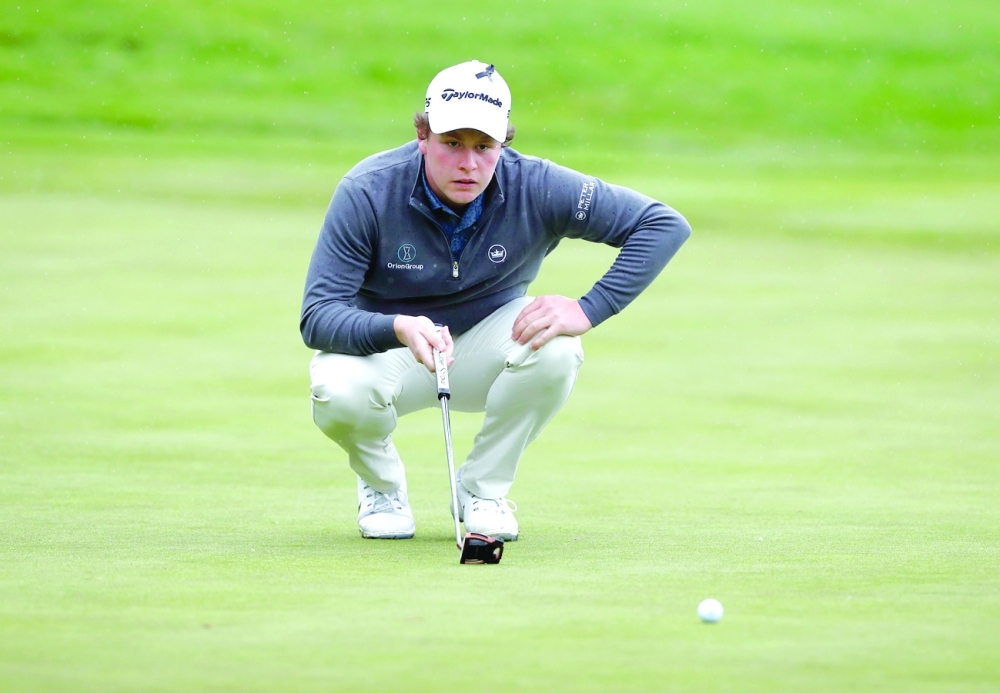 Scotland's Robert MacIntyre lines up a putt during the second round at British Masters. -- Reuters