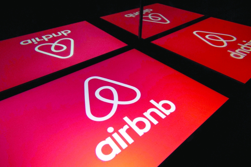 The logo of the online lodging service Airbnb displayed on a tablet in Paris - AFP

