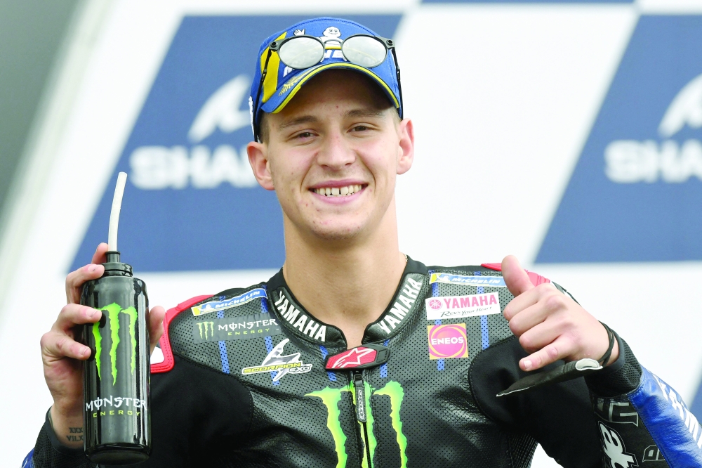Monster Energy Yamaha MotoGP French rider Fabio Quartararo reacts after taking the pole position of the Q2 qualifying session in 1'32.600, of the MotoGP, ahaead the French Moto GP Grand Prix in Le Mans, northwestern France, on May 15, 2021.  / AFP / Jean-Francois MONIER

