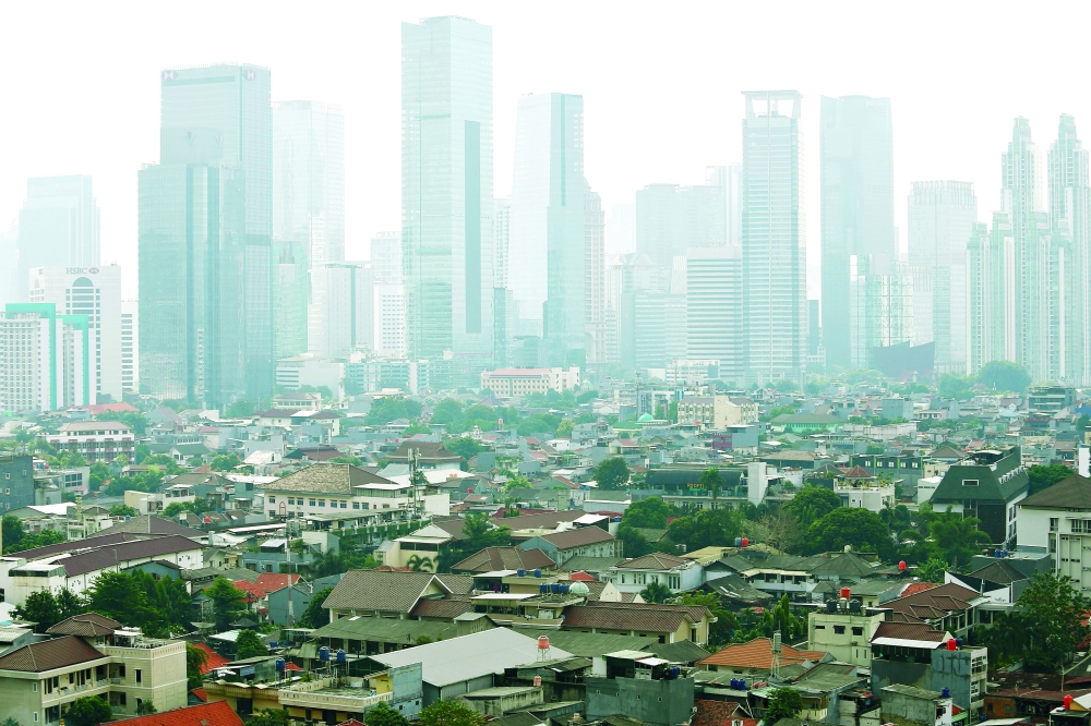A general view of business buildings as smog covers the capital city of Jakarta, Indonesia, on Wednesday. - Reuters