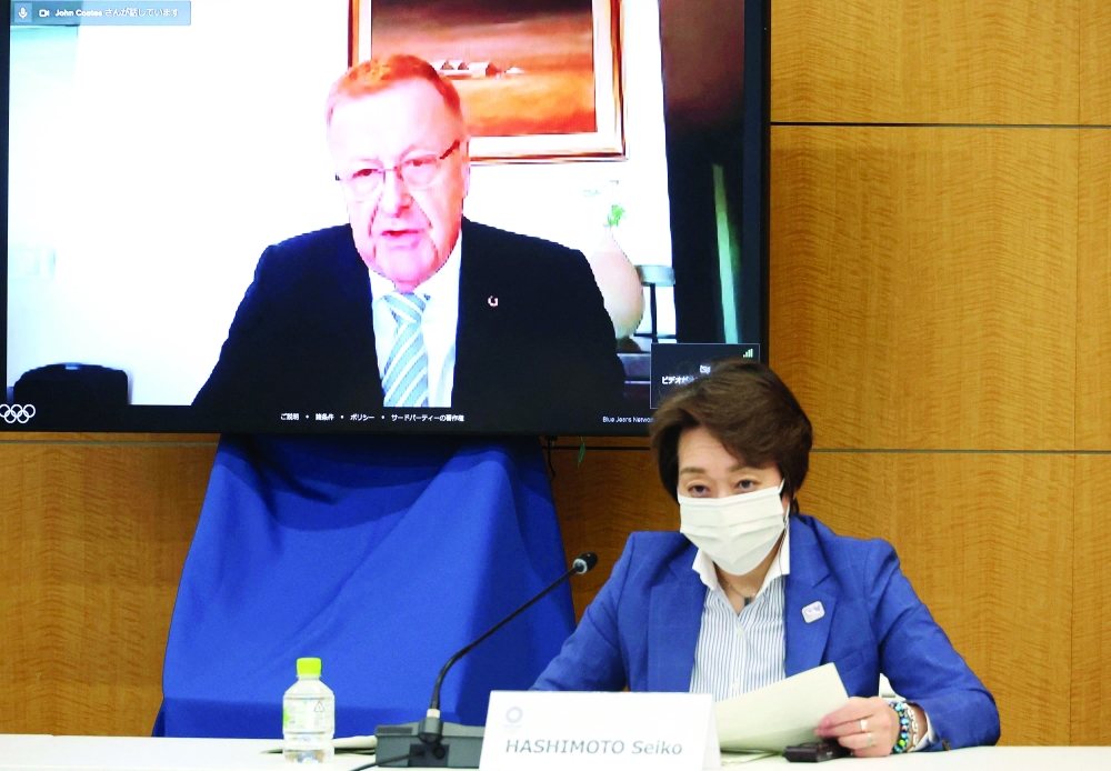 IOC vice-president Johan Coates (on screen) delivers an opening speech at a meeting of the IOC Coordination Commission for the Tokyo 2020 Olympics, while Tokyo 2020 Olympics organizing committee president Seiko Hashimoto listens, in Tokyo. -- AFP
