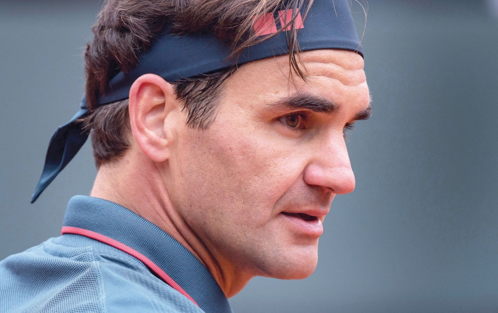 Switzerland’s Roger Federer reacts during his ATP 250 Geneva Open match against Spain’s Pablo Andujar. — AFP