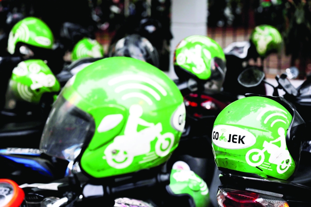 Gojek driver helmets are seen during Go-Food festival in Jakarta. - Reuters