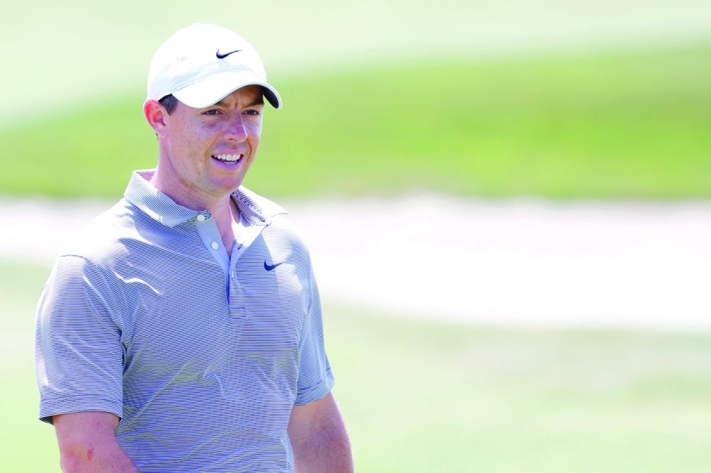 Rory McIlroy smiles on the 15th green during a practice round for the PGA Championship tournament at Ocean Course. -- USA Today Sports
