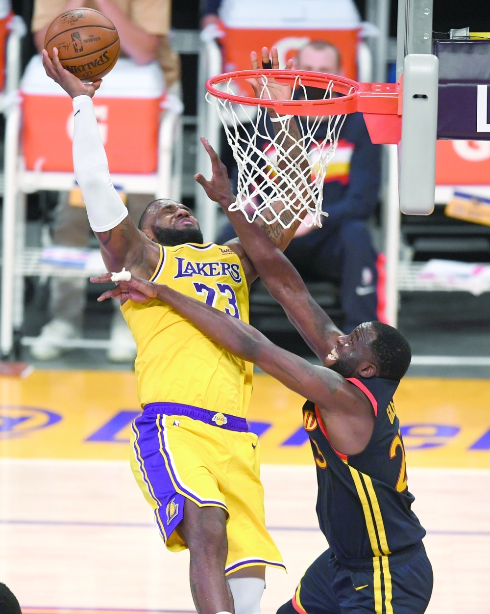 Los Angeles Lakers' LeBron James (23) is fouled by Golden State Warriors' Draymond Green (23) as he goes up for a basket at Staples Center. -- USA Today Sports
