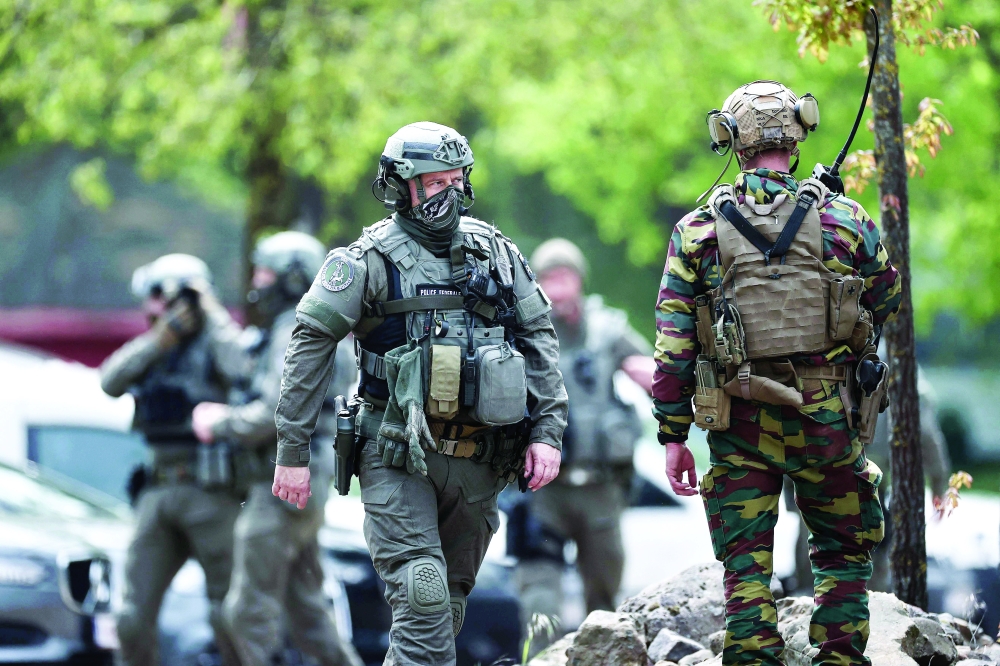 Belgian soldiers patrol at an entrance of Nationaal Park Hoge Kempen in Maasmechelen, Northern Belgium. - AFP
