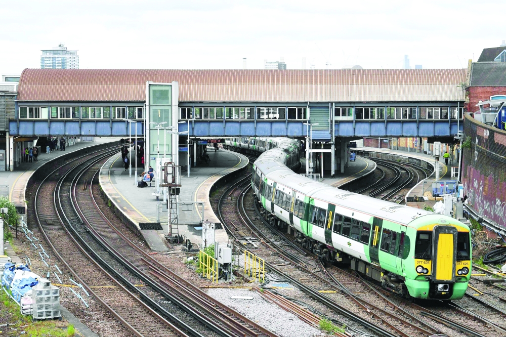 A Southern Rail train leaves Clapham Junction station in London. - AFP