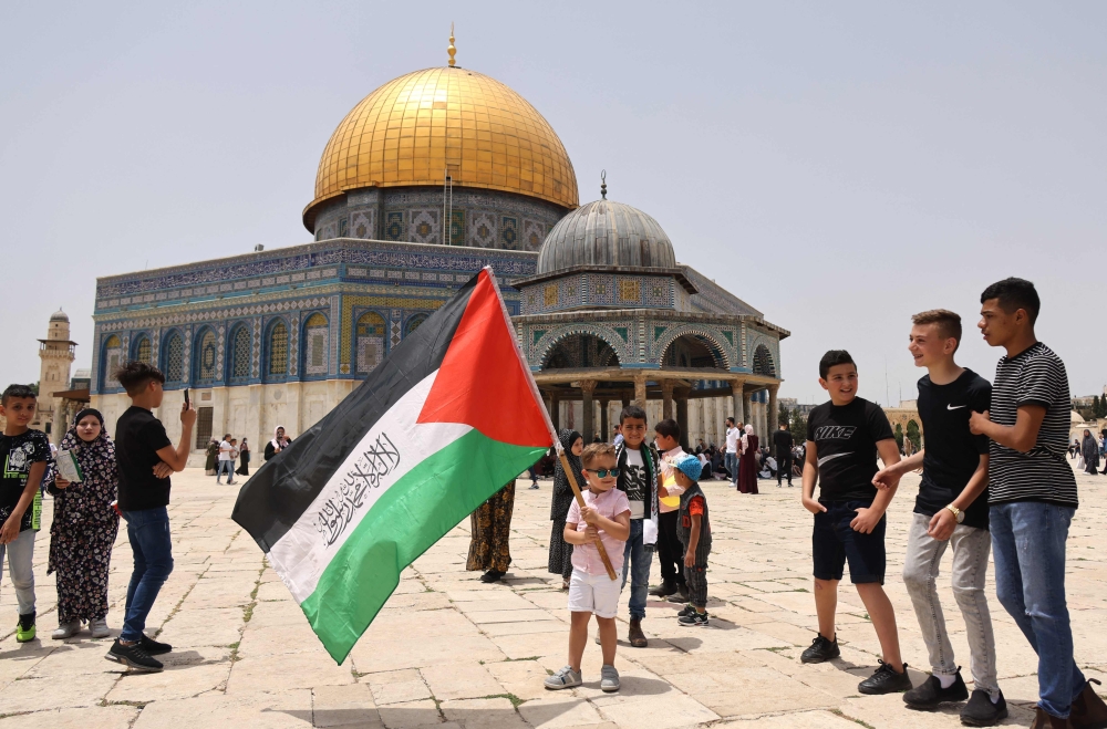 Palestinian Muslim worshippers gather for prayers in Jerusalem's al-Aqsa mosque compound
