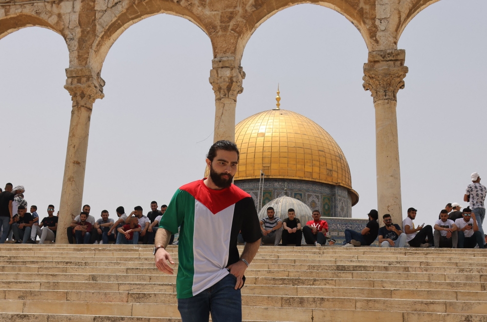 Palestinian Muslim worshippers gather for prayers in Jerusalem's al-Aqsa mosque compound