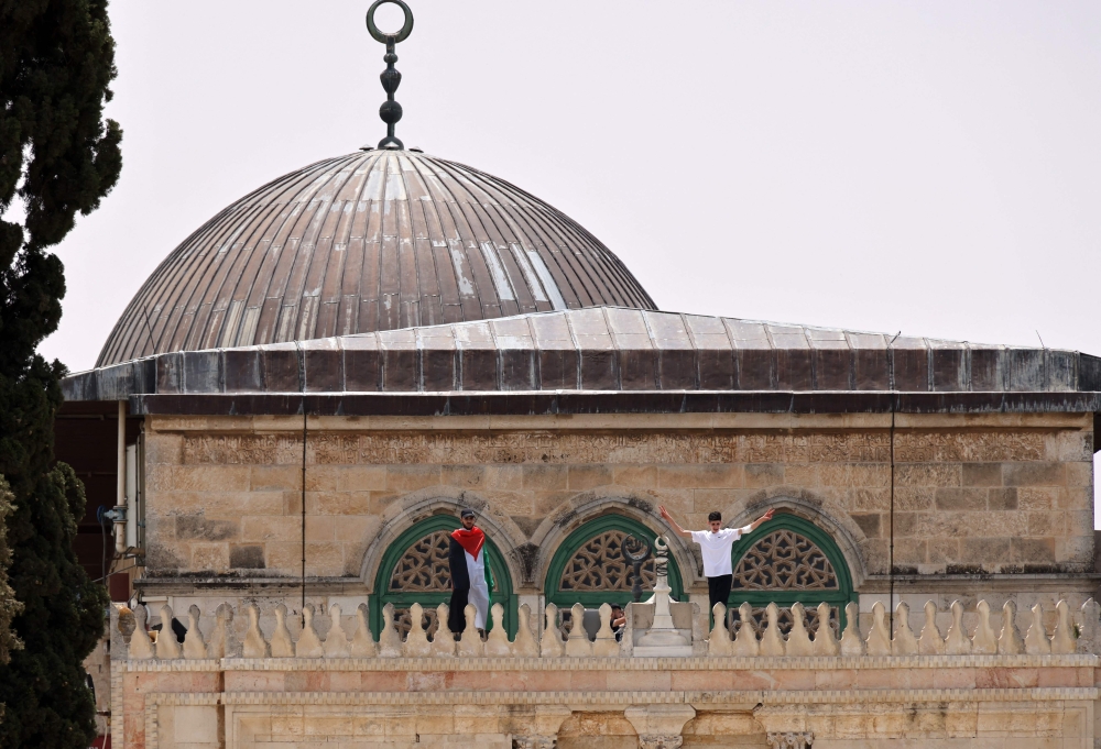 Palestinian Muslim worshippers gather for prayers in Jerusalem's al-Aqsa mosque compound, the third holiest site of Islam, on May 21, 2021.