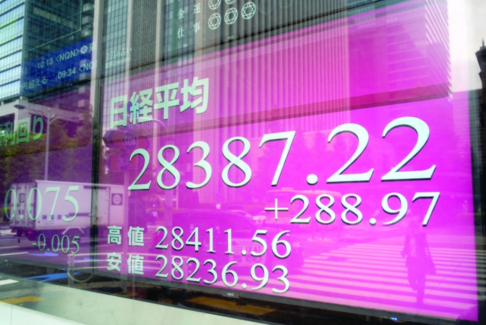 An electronic quotation board displays share prices in the morning trading on the Tokyo Stock Exchange in Tokyo. - AFP