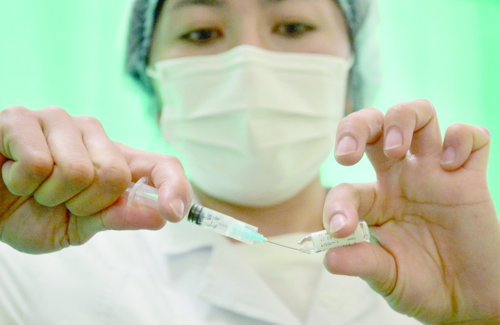 A member of the medical staff prepares a dose of Russia's Sputnik V Covid-19 vaccine at a vaccination centre in Bishkek. - AFP
