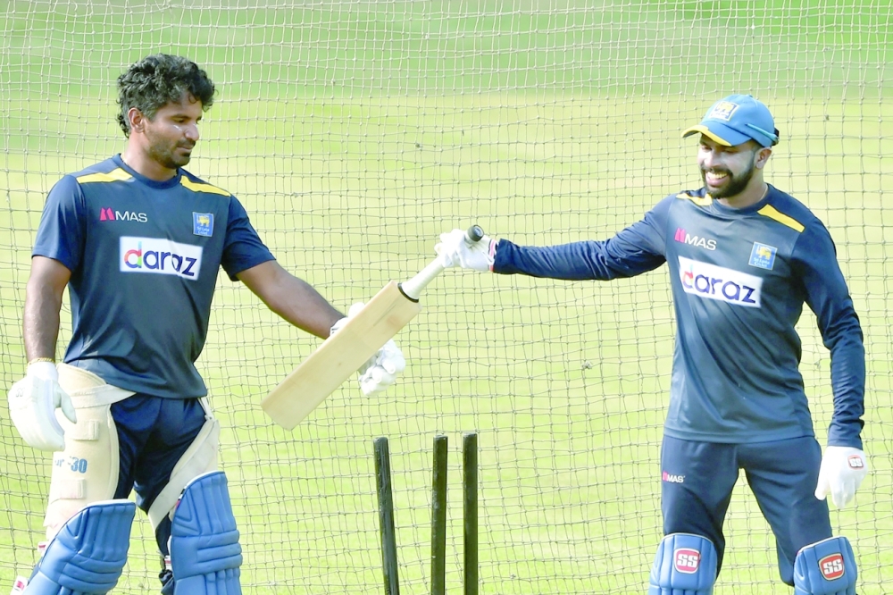 Sri Lanka captain Kusal Perera (L) and Niroshan Dickwella attend a practice session in Dhaka. -- AFP
