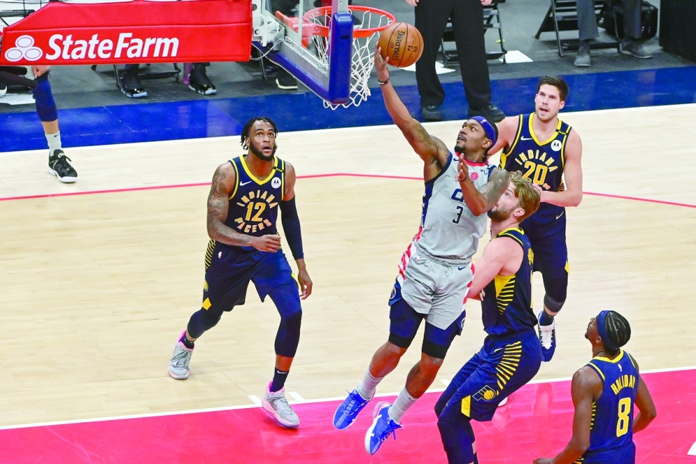 Washington Wizards' Bradley Beal (3) shoots a lay-up as Indiana Pacers defenders look on at Capital One Arena. -- USA Today Sports