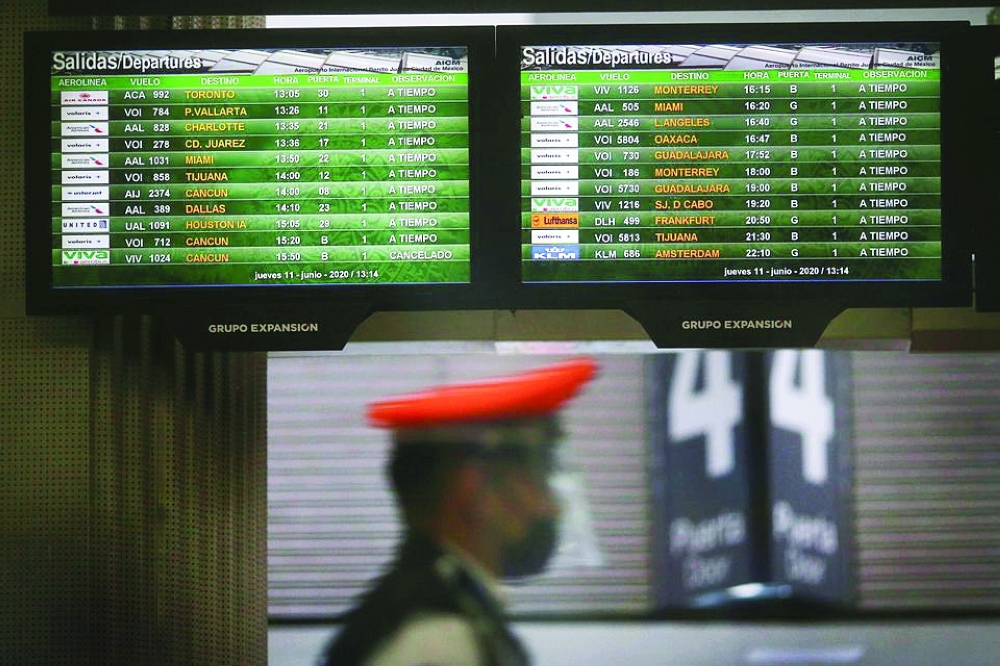 Screens show flight information at the almost empty Benito Juarez international airport in Mexico City, Mexico. — Reuters