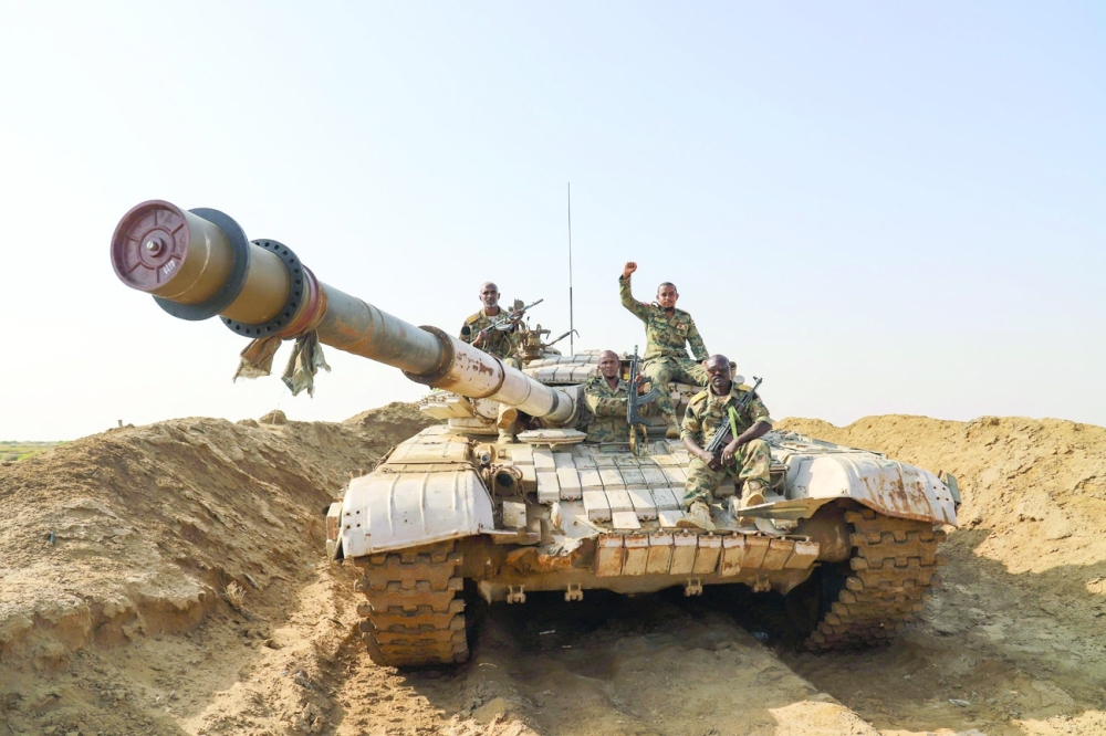 Sudanese-Yemeni military force battling fighters near the border with Saudi Arabia in Yemen's northern coastal town of Midi, in Hajjah governorate. - AFP