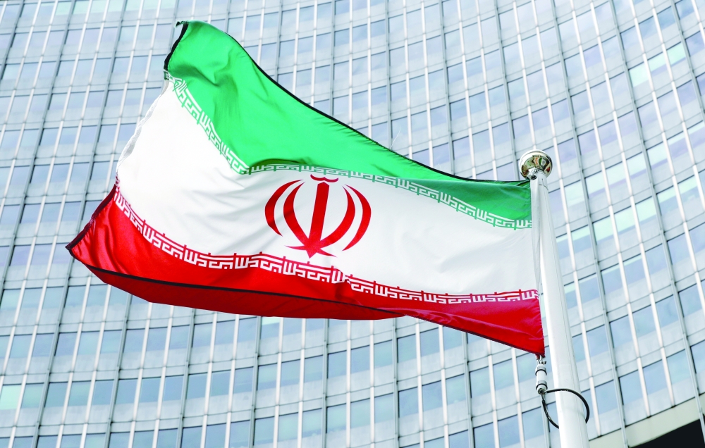 An Iranian flag flutters in front of the International Atomic Energy Agency (IAEA) headquarters in Vienna. - Reuters File Photo
