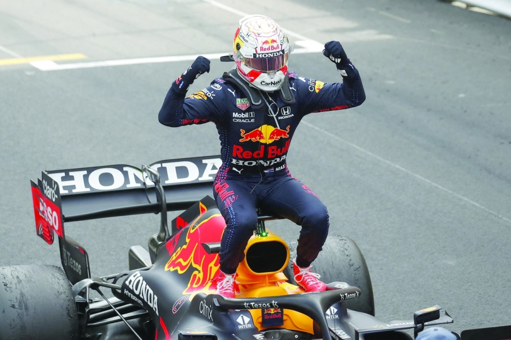 Winner Red Bull's Dutch driver Max Verstappen celebrates after the Monaco Formula 1 Grand Prix at the Monaco street circuit in Monaco, on May 23, 2021. / AFP / POOL / GONZALO FUENTES


