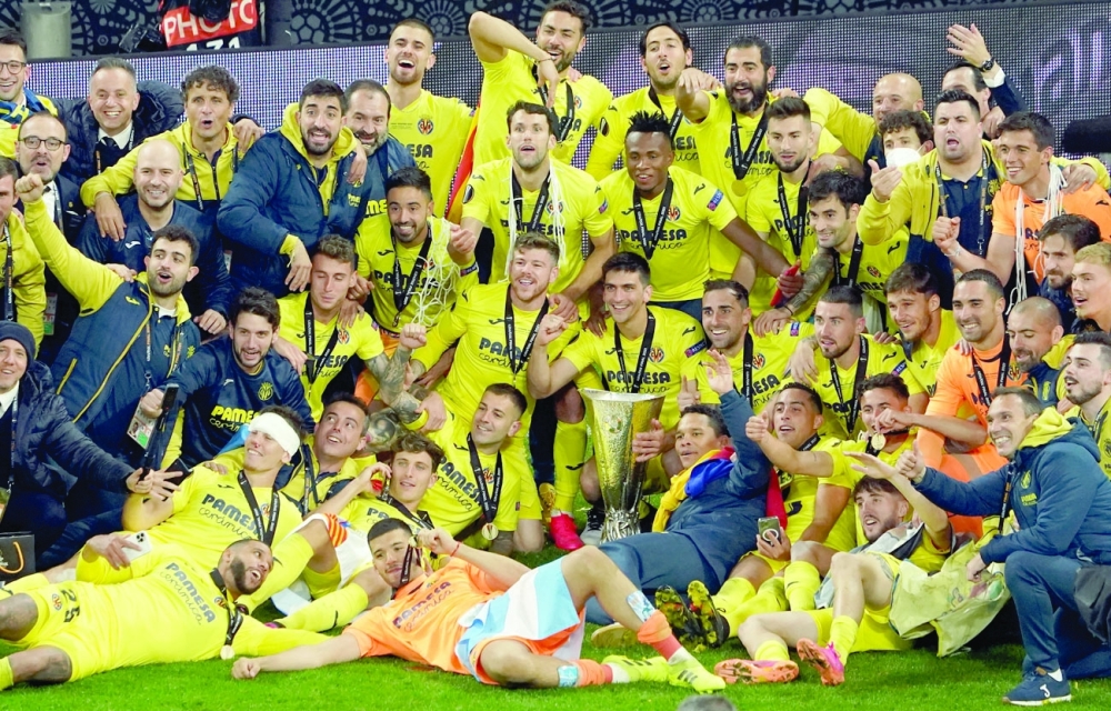 Villarreal players celebrate winning the Europa League at Gdansk, Poland. -- Reuters