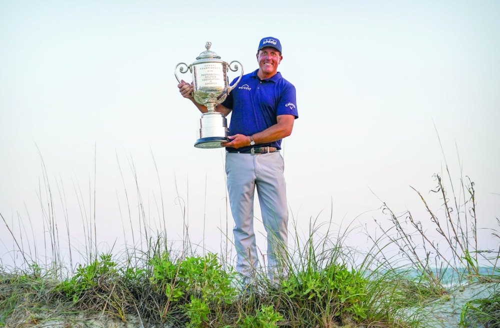 Phil Mickelson poses with the Wanamaker Trophy after he won the PGA Championship tournament. -- USA Today Sports