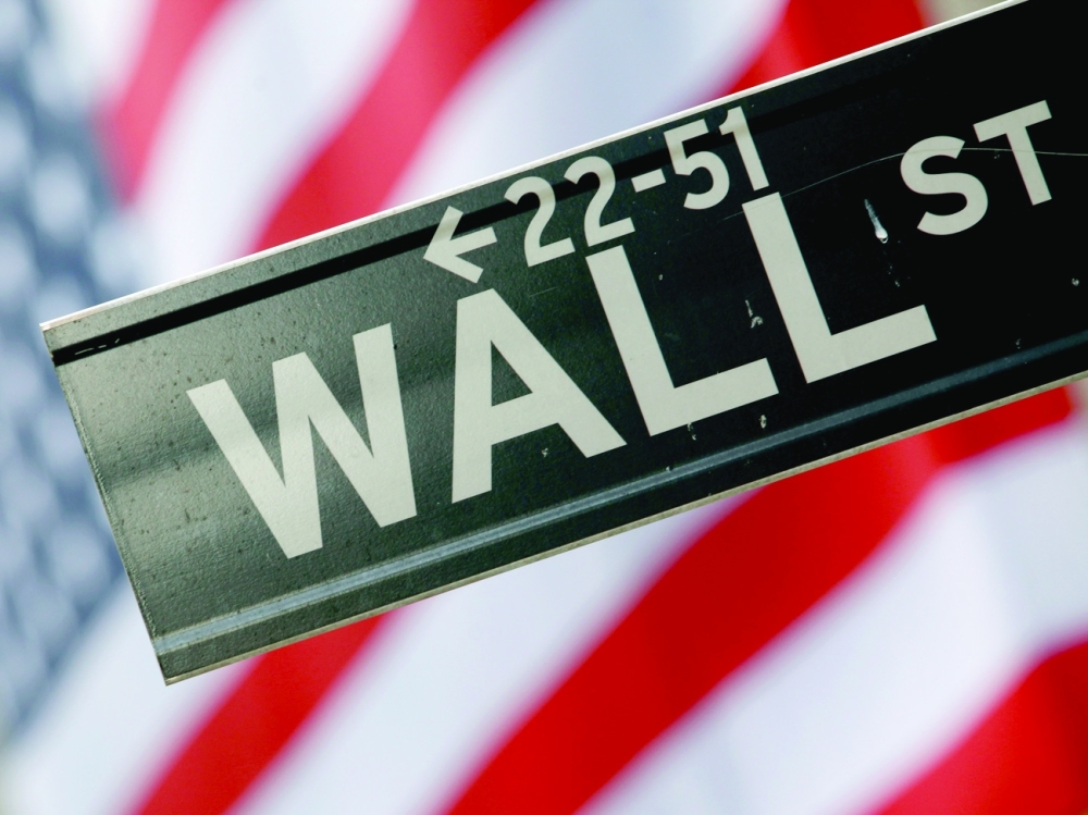 A street sign is seen in front of the New York Stock Exchange on Wall Street in New York. - Reuters