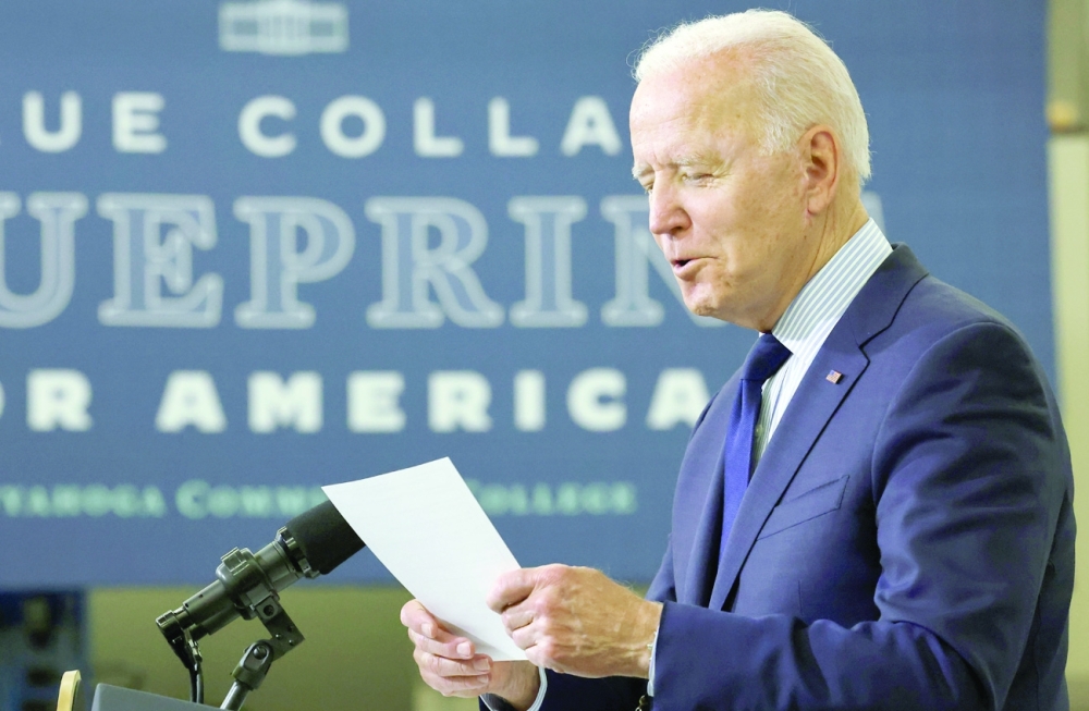 US President Joe Biden holds a list of Republican lawmakers as he delivers remarks on the economy at Cuyahoga Community College in Cleveland, Ohio. - Reuters 