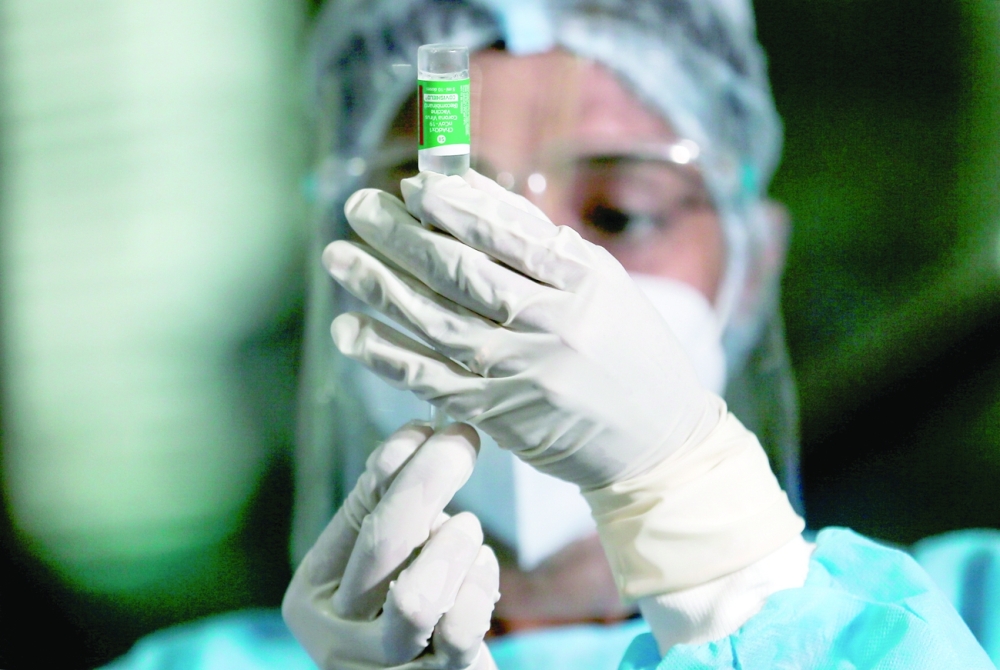 A health official draws a dose of the AstraZeneca's vaccine manufactured by the Serum Institute of India, at Infectious Diseases Hospital in Colombo. - Reuters
