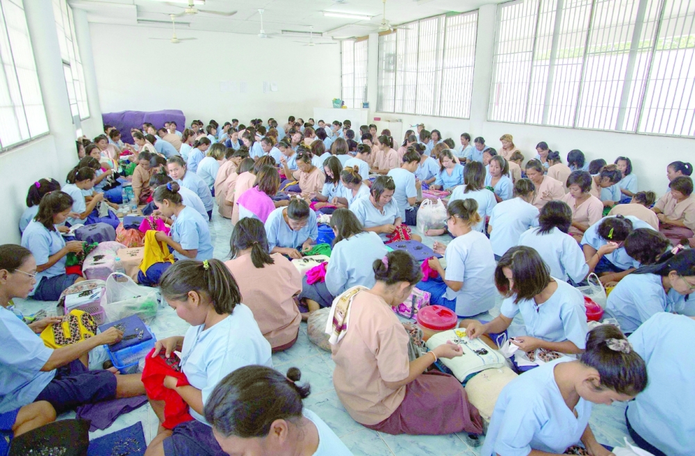 Prison inmates work in a sewing workshop at a prison in Ayutthaya, north of Bangkok. - AFP File Photo 