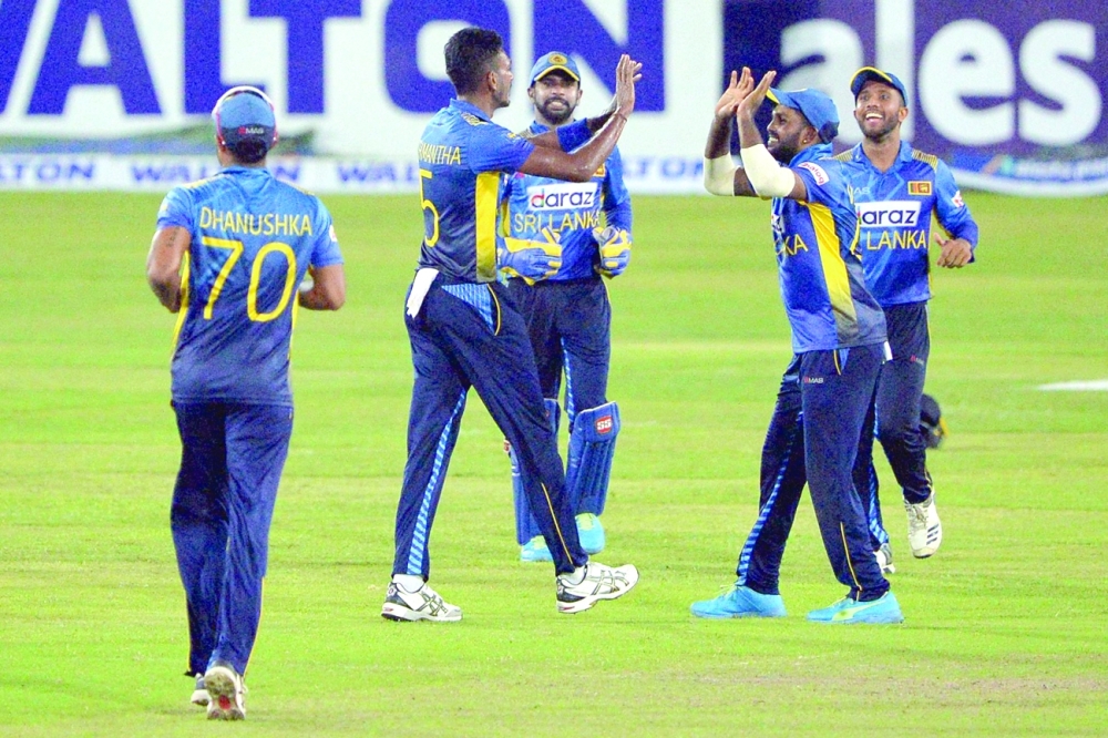 Sri Lankan players celebrate after the dismissal of Bangladesh's Taskin Ahmed during the third and final ODI in Dhaka. -- AFP
