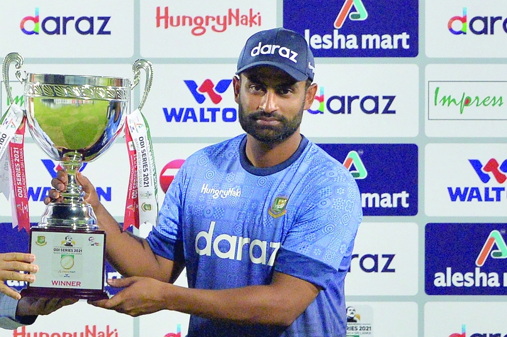 Bangladesh's captain Tamim Iqbal holds the tournament trophy. -- AFP