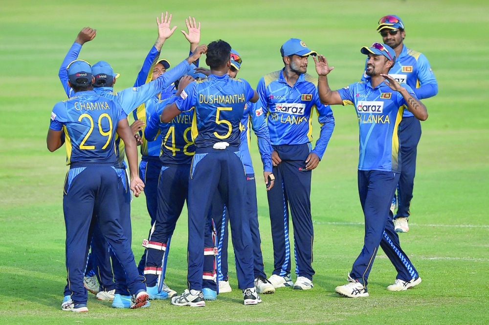 Sri Lankan players celebrate after the dismissal of Bangladesh's Naim Sheikh during the third and final ODI in Dhaka. -- AFP
