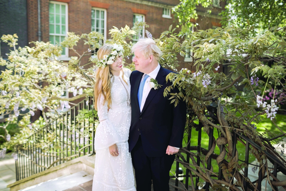 Boris and Carrie Johnson are seen in the garden of 10 Downing Street, after their wedding, in London on Saturday. Reuters