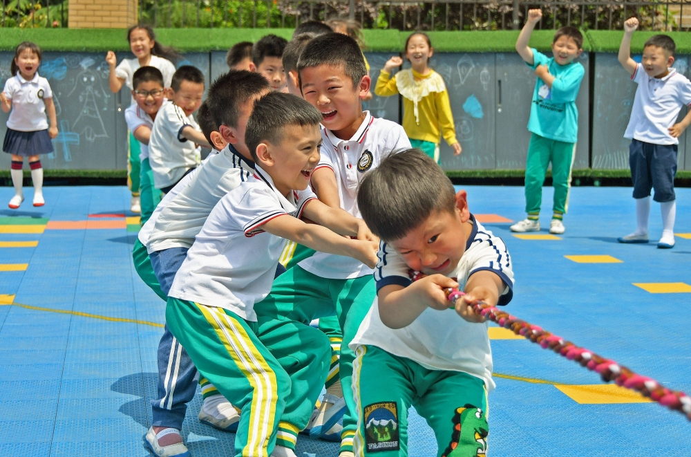 Children play at a kindergarten in Yantai in China's eastern Shandong province on May 31, 2021. 
