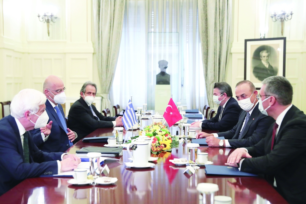 Greek Foreign Minister Nikos Dendias meets his Turkish counterpart Mevlut Cavusoglu at the Ministry of Foreign Affairs in Athens. - Reuters 

